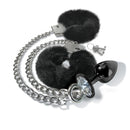 NIXIE Metal Butt Plug & Furry Handcuff Set Black with faux fur cuffs and detachable chain featuring a sparkling jewel butt plug.