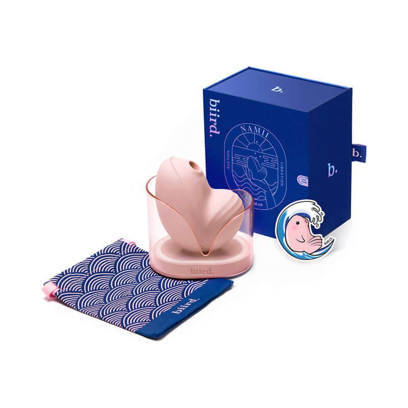 Biird Namii Clitoral Stimulator Peach with packaging and accessories displayed.