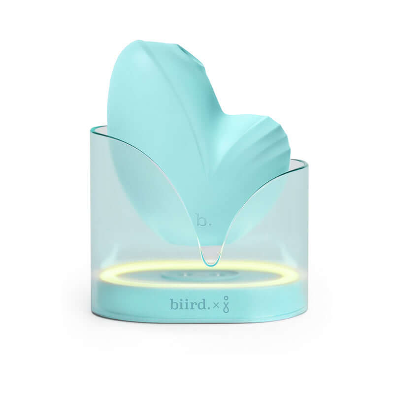 Biird Namii Jouissance Club Edition Clitoral Stimulator displayed in a stylish stand with soft blue silicone design.