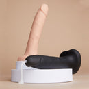 Strap-on-me Squirting Cum Realistic Dildo Large Vanilla displayed with a black dildo and squirting feature.