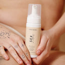 Sex Au Naturel Prebiotic Intimate Wash Gentle Foam in a hand, showcasing its gentle foam texture for intimate wellness.