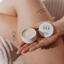 Bijoux Indiscrets Slow Sex Massage Candle in hand, showcasing its elegant design for intimate relaxation.