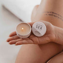 Bijoux Indiscrets Slow Sex Massage Candle in hand, ready for a sensory ritual experience.