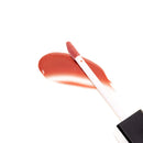 Eye of Love Matchmaker Crimson Kiss Pheromone Lip Gloss applicator with glossy crimson shade on a white background.