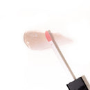 Eye of Love Matchmaker Pink Pulse Pheromone pH Lip Stain glimmering lip gloss with applicator on white background.