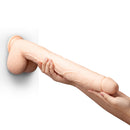 b-Vibe Bone 17 Inch Deep-Insert Dildo with Balls held in hand, showcasing its lifelike detail and sculpted design.
