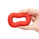 b-Vibe Flex Ring Bulk Silicone Cock Ring Red held in hand, showcasing its bold design and thicker structure.