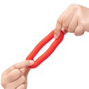 b-Vibe Flex Ring Bulk Silicone Cock Ring Red in hands demonstrating flexible design and texture.