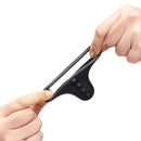 Person demonstrating b-Vibe Flex Ring Shaft Silicone Cock Ring Ball Stretcher, showcasing its stretchy design.