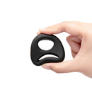 b-Vibe Flex Ring 8 Silicone Cock and Ball Ring Black held in hand, showcasing its unique figure-8 design.