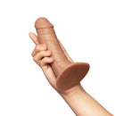 Together Toy 6.5 Inch Realistic Dildo Caramel held in hand showcasing its lifelike design and warm caramel finish.