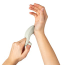 Hands demonstrating the Dame Hug Vibrating Couples Ring Fog, designed for shared pleasure and adjustable fit.