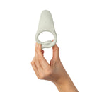 Dame Hug Vibrating Couples Ring Fog held in hand, showcasing its ergonomic design for shared pleasure.
