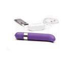 OhMiBod Freestyle G-Spot Vibrator Purple displayed with audio device for wireless convenience.