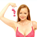 Ohmibod Lovelife Flex Kegel Exerciser 3-piece Set Pink held by a woman in a pink bra, showcasing the product's design.