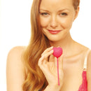 Ohmibod Lovelife Flex Kegel Exerciser 3-piece Set Pink held by a smiling woman, ideal for pelvic floor strengthening.