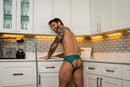 Male Power Ripple Moon Jock Teal S/M showcased in kitchen, highlighting bold style and supportive fit.