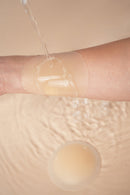 Uva Circular Nipple Covers Nude demonstration on skin, showing seamless coverage and water resistance.