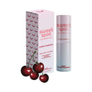 Sweetums Sweet Spot Flavored Fragrance Cherry Bombshell packaging and stick with cherries, showcasing its juicy scent.
