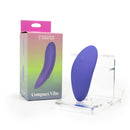 Spectrum Essentials Compact External Vibrator Purple displayed with packaging on a stand.