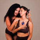 Je Joue Mio V2 Vibrating Cock Ring Blue showcased by two women promoting intimacy and enjoyment.