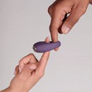Je Joue Mio V2 Vibrating Cock Ring Blue held between two fingers, showcasing shared intimacy and luxury-grade design.