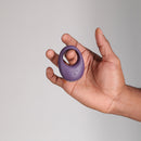 Je Joue Mio V2 Vibrating Cock Ring Purple held in a hand, showcasing its luxurious design and functionality.