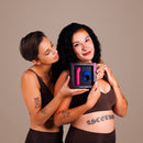 Je Joue Couple's Collection Vibrator Gift Set featuring G-Spot Bullet and Mio, held by two partners.
