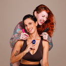 Je Joue Couple's Collection Vibrator Gift Set featuring two women holding vibrators, showcasing intimacy and pleasure.