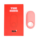 Ily By Je Joue Vibrating Cock Ring next to its red packaging box, showcasing its sleek design.