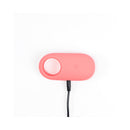 Ily By Je Joue Vibrating Cock Ring charging base with a pink silicone design and a black charging cable.