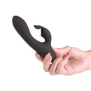 NS Novelties Love Notes Stay Vibrator Black held in a hand for discreet personal stimulation.