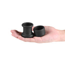 Renegade Buster Silicone Ball Stretcher Black displayed in a hand, showcasing two-piece silicone construction.