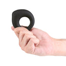 Hand holding Renegade The Performer Vibrating Cock Ring Black on a white background.