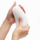 Hands holding the Tenga 3dx Zen Male Masturbator Sleeve showcasing its ergonomic design and tactile texture.