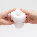Tenga 3dx Zen Male Masturbator Sleeve held in hands, showcasing its sleek design and textured features.