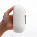 Tenga 3dx Zen Male Masturbator Sleeve held in hand, featuring a sleek design and water droplets.