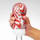Close-up of Super Tenga Tornado Blast Masturbator held in hand with vibrant red and silver design.