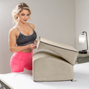 Liberator Flip Ramp Sex Positioning Pillow With Slip Cover Lush Cream displayed with a model in a modern bedroom setting.