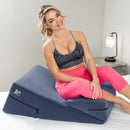Liberator Wedge & Ramp Sex Combo Velvet Blue with a woman demonstrating its use on a bed.