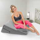 Liberator Wedge & Ramp Sex Combo Original Size Grey with a model demonstrating its use for enhanced comfort.