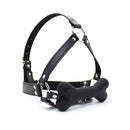 Ple'sur Face Harness Dog Bone Gag in black leather with silicone bone-shaped mouthpiece for BDSM roleplay.