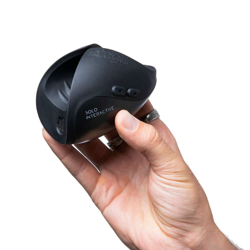 Hot Octopuss Pulse Solo Interactive Black in hand, showcasing its sleek design and interactive features.