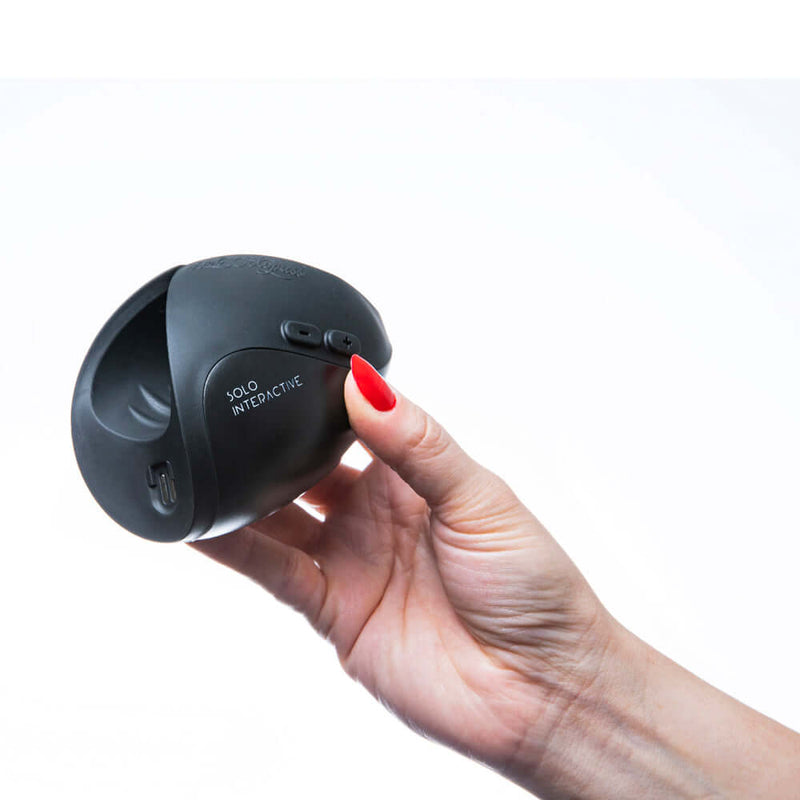 Hand holding Hot Octopuss Pulse Solo Interactive Black, showcasing its sleek design and interactive features.
