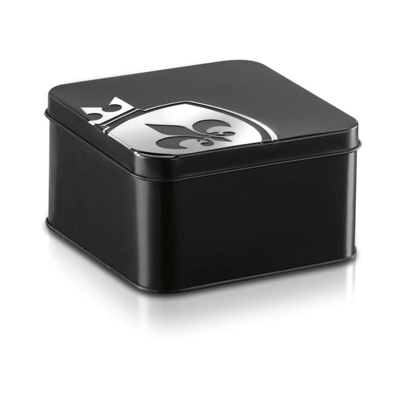 Mystim Pearly Pete Corona Glans Strap packaging in a sleek black tin with a decorative emblem on top.