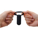 Tenga SVR Smart Vibe Ring Black held between two hands, showcasing its sleek design and compact size.