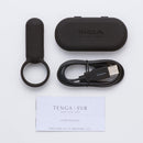 Tenga SVR Smart Vibe Ring Black with charging cable and user manual on a light background.