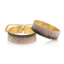 Rianne S Diamond Handcuffs Liz featuring sparkling black, white and purple stones on a gold finish.