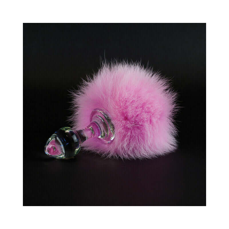 Crystal Delights Magnetic Bunny Tail Plug Pink featuring soft pink fur and glass handle, ideal for playful elegance in pleasure.