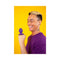 Cute Little Fuckers Princette Puppypus Purple held by a smiling person against a bright yellow background.